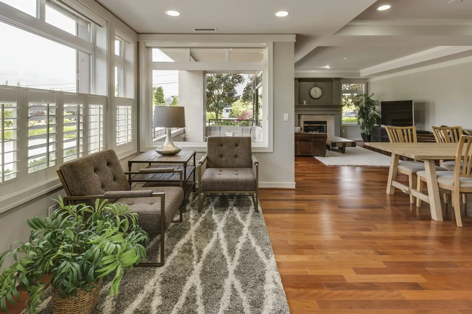 Living room with new wide-plank hardwood floors and large windows